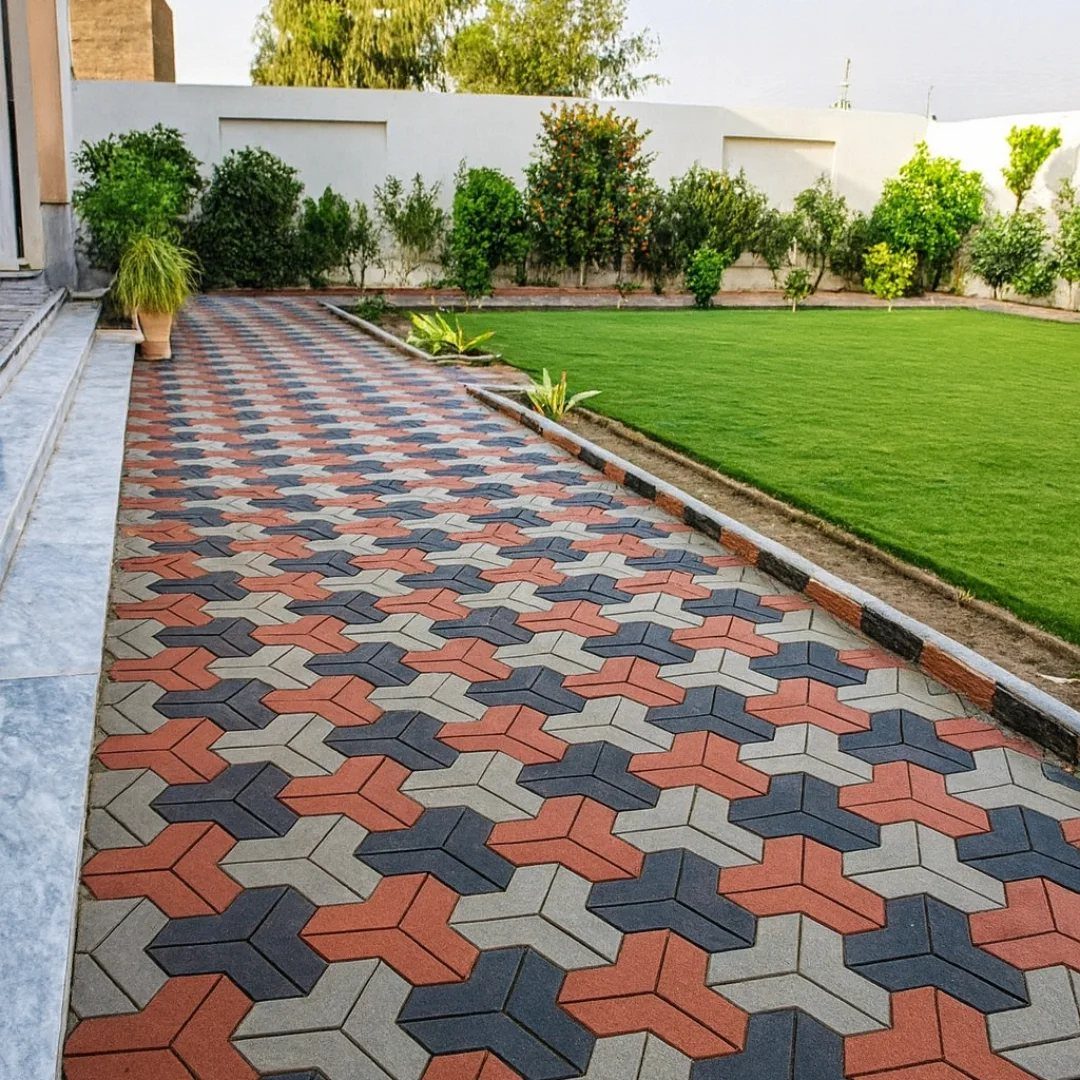 26 Front Garden Ideas for Curb Appeal and Small Yards 4 Interlocking red and grey geometric brick pavers forming a garden walkway next to a lawn.