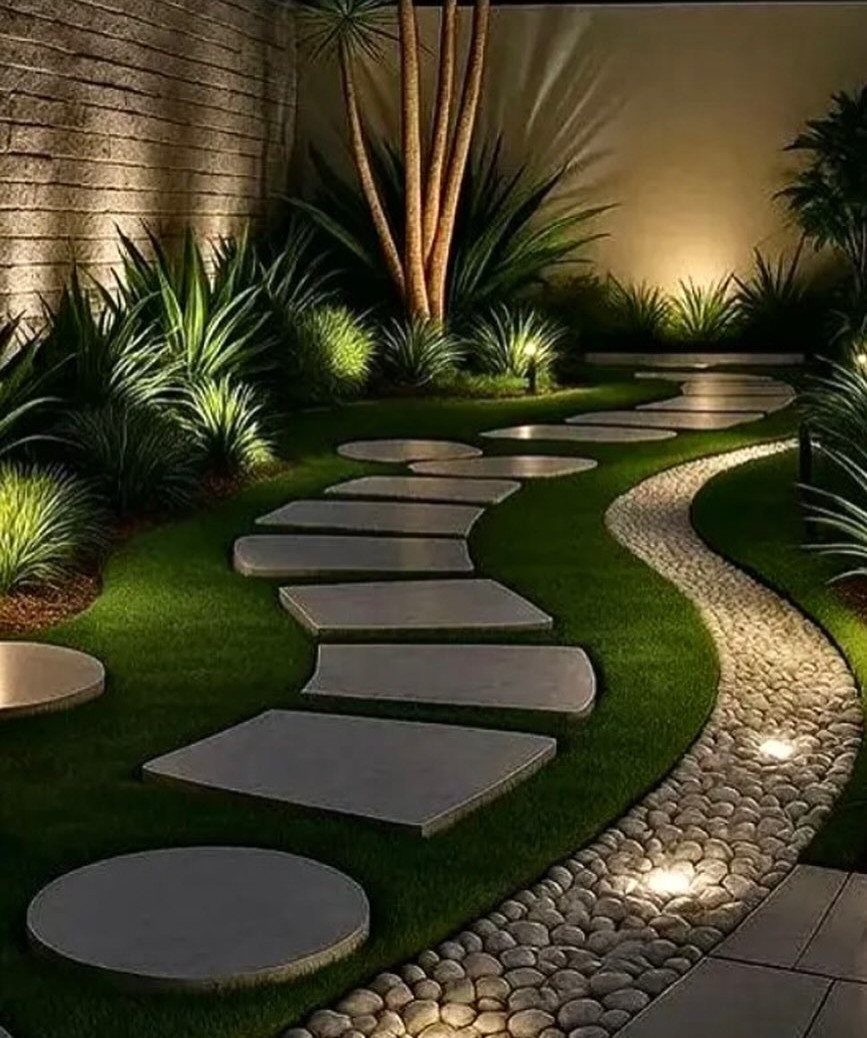 Curved stone path with recessed LED lights embedded in a pebble border.