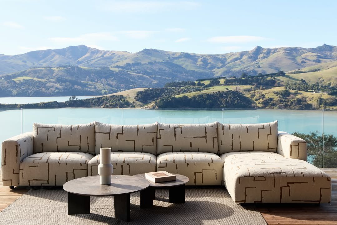 Outdoor Modular Seating: 20 Sectionals and Sofa Sets 10 Cream modular outdoor sectional with geometric patterns on a deck overlooking mountains and lake.