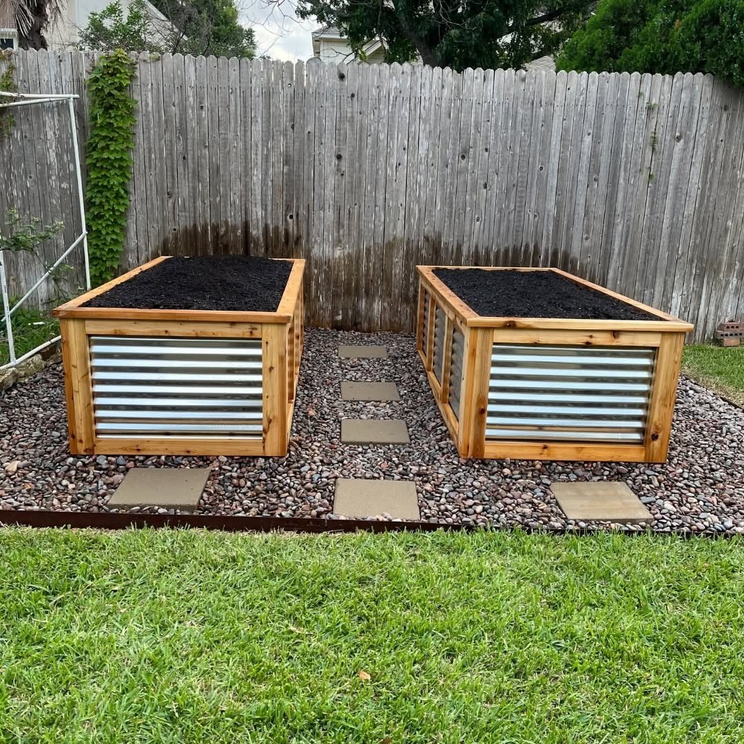 Raised Beds Garden: 25 Ideas from Wood, Metal, and Stone 5 Two corrugated metal raised garden beds with wooden frames on a pebble path.